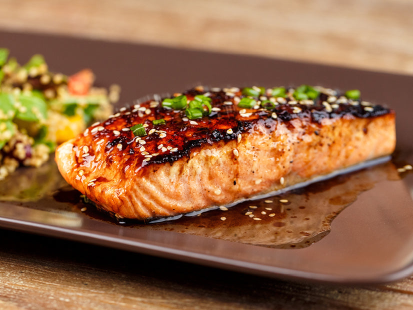 Grilled salmon glazed with prickly pear soy marinade, green onions and sesame seeds