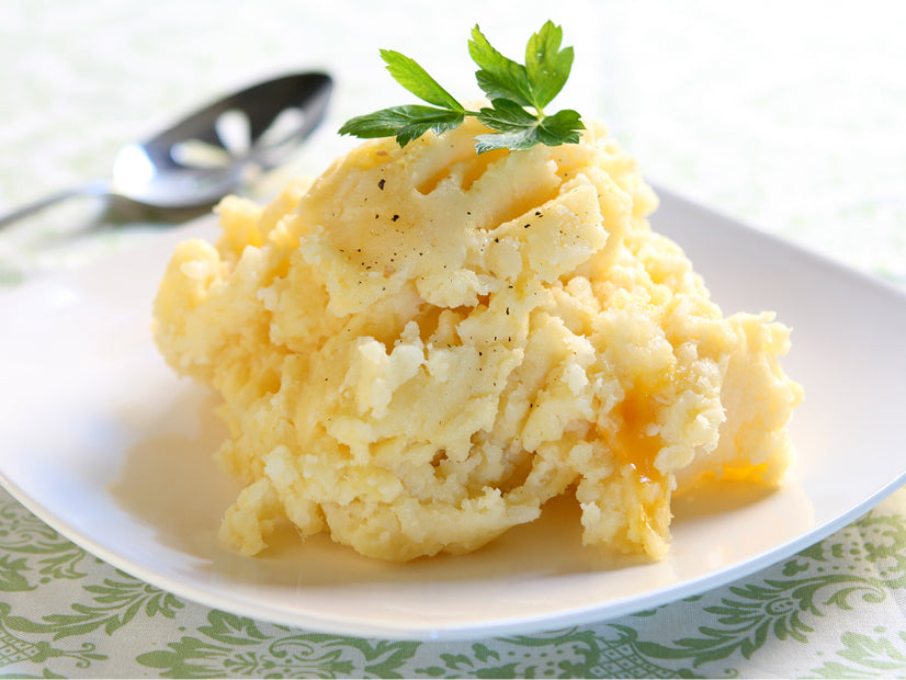 Chipotle Cheddar Mashed Potatoes served on a white plate