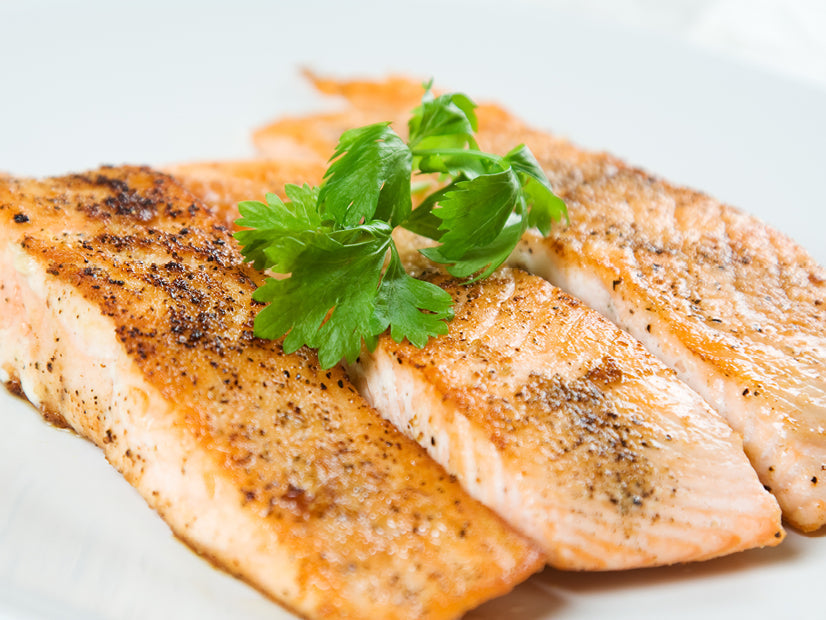 Pepper-glazed salmon topped with fresh cilantro